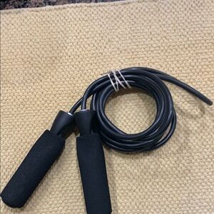 2 Black Jump Ropes,one with Foam Handles and one with swivel handles